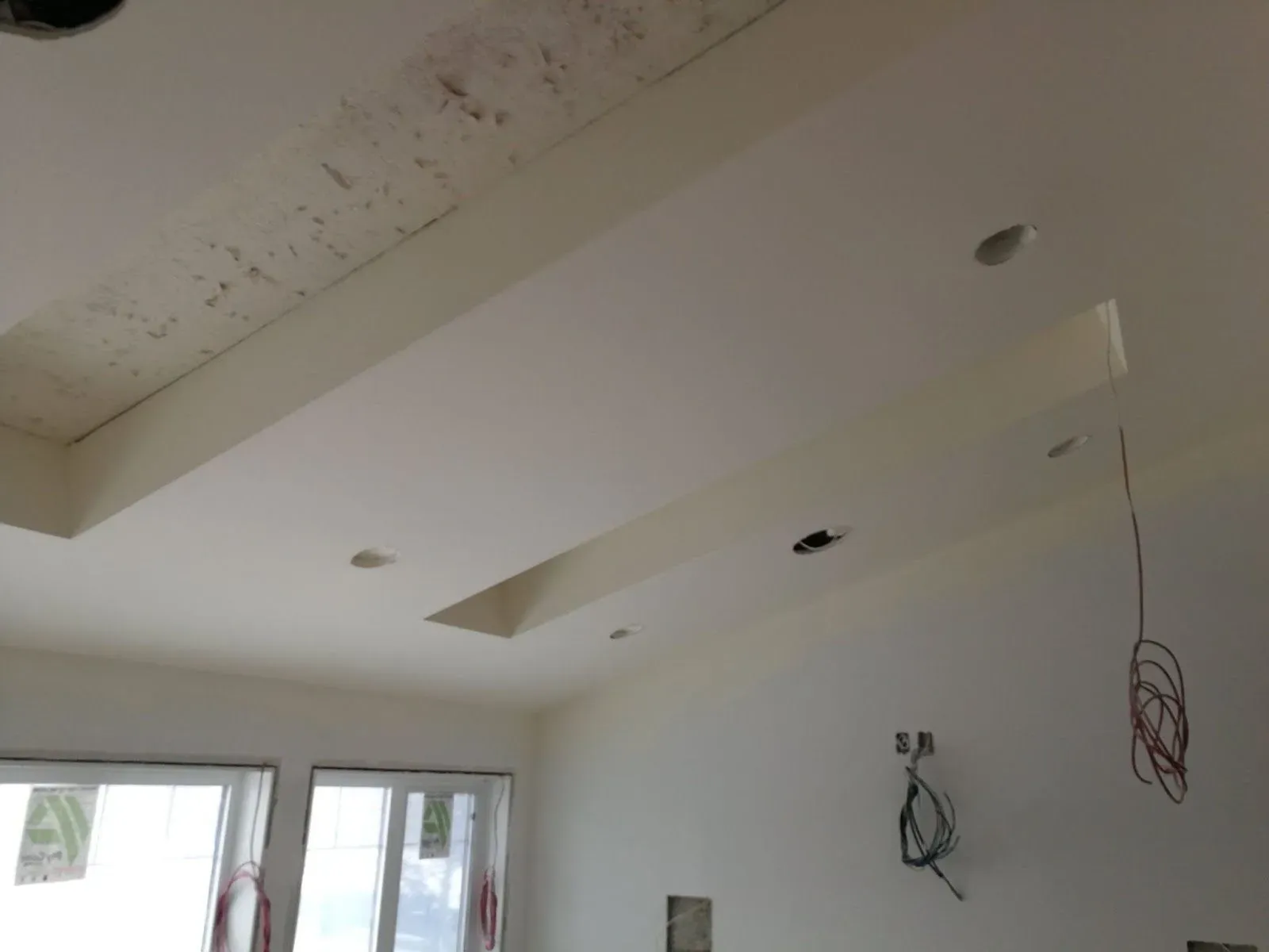 Ceiling patched around pot lights before sanding