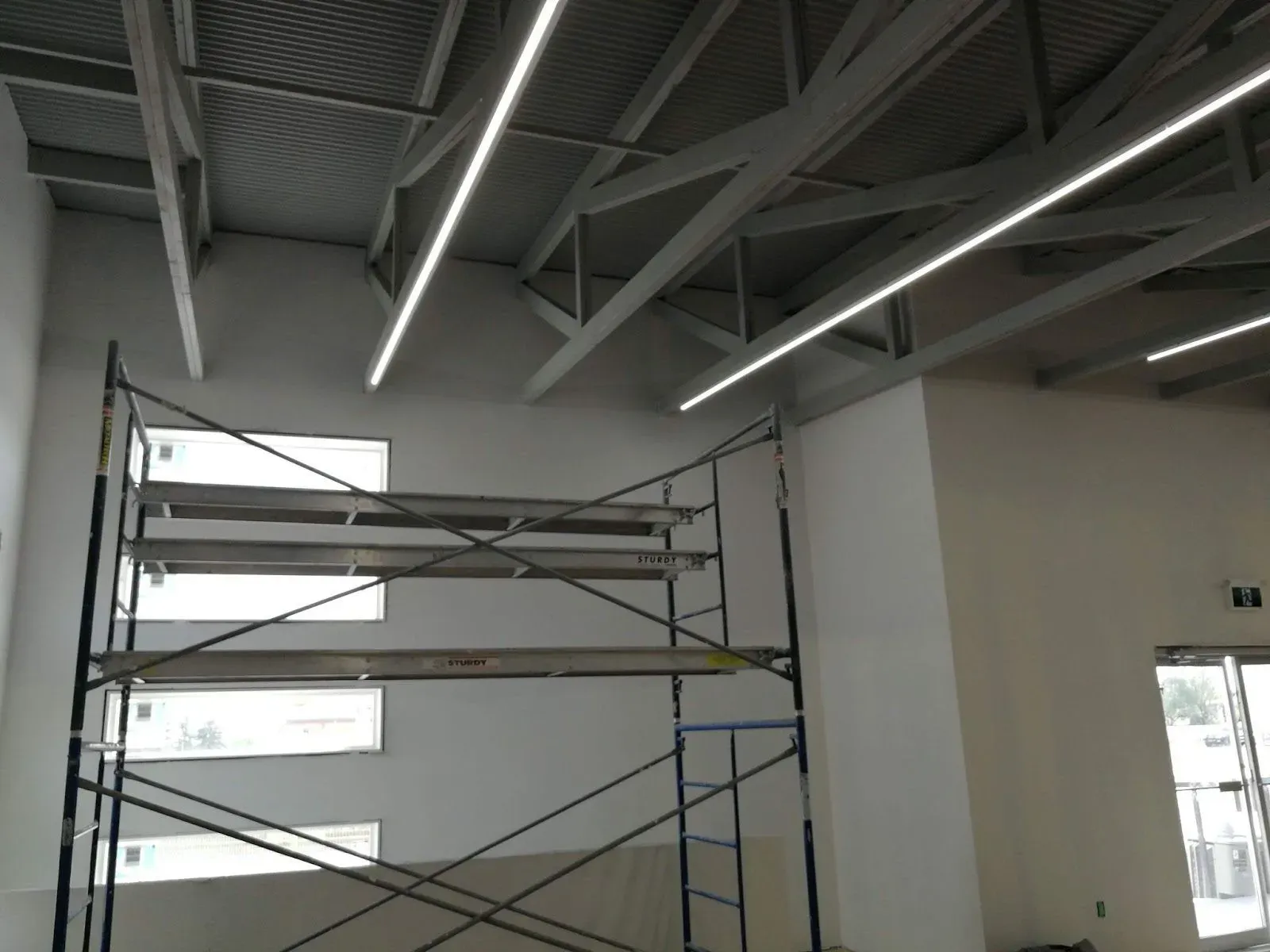 Scaffolding set up to finish a high commercial ceiling